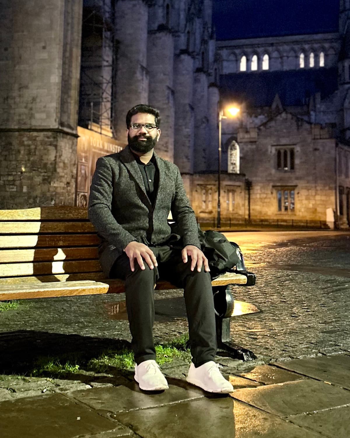 Rajesh Banoth, Founder and Director of Triskelion AI Systems, seated in front of York Minster at dusk